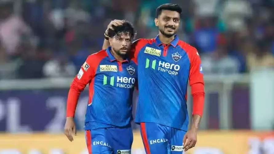 Delhi Capitals (DC) Kuldeep Yadav (left) seen with captain Axar Patel