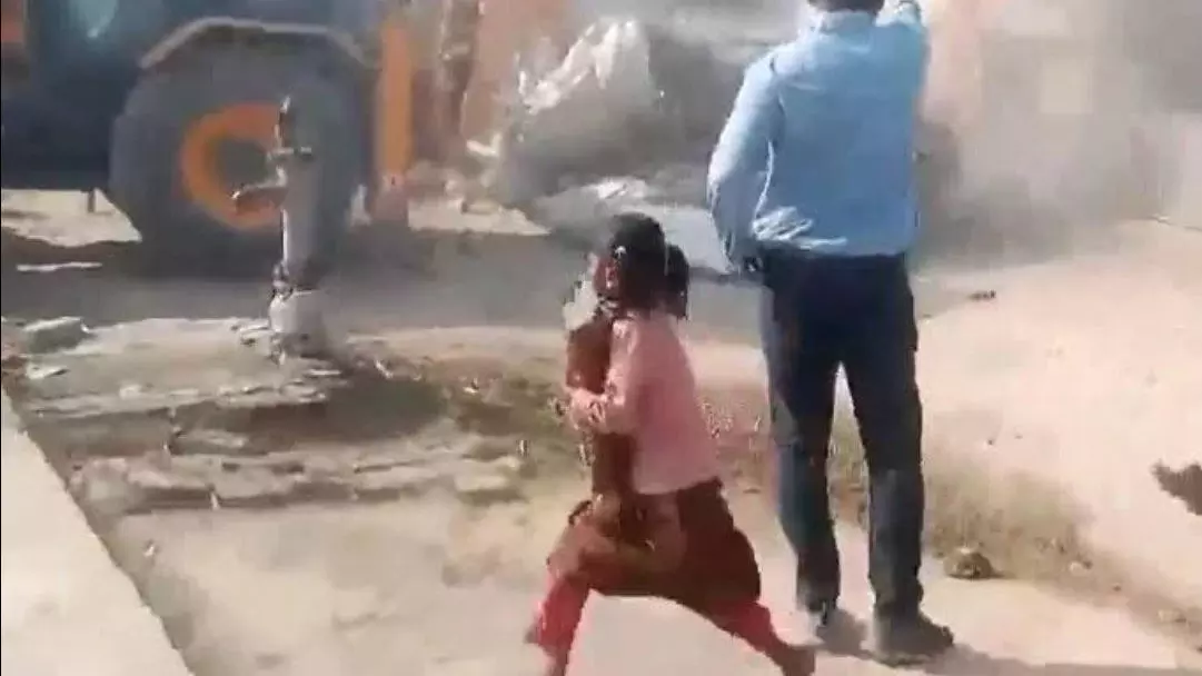 Prayagraj demolition video of girl running with books