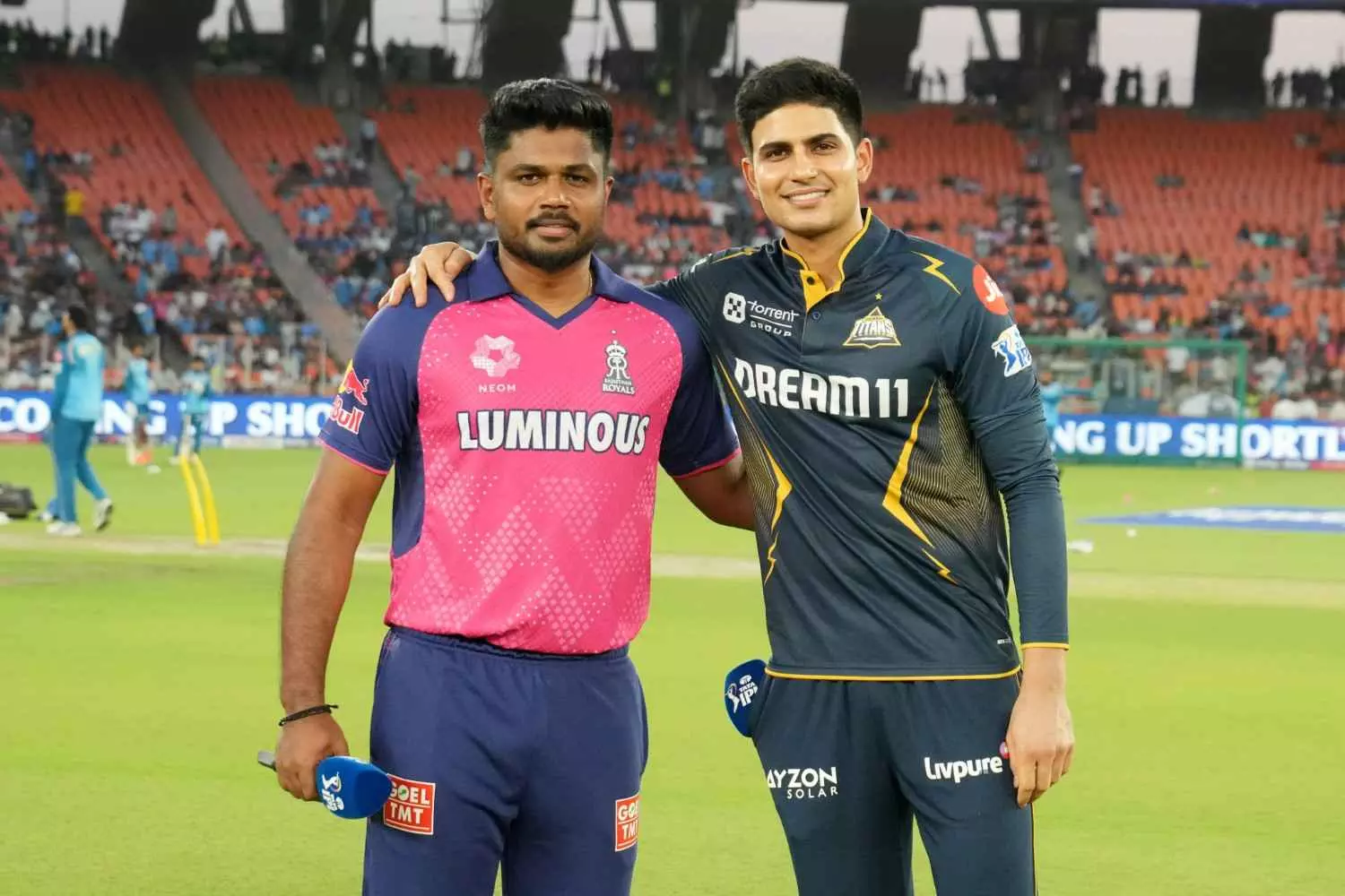 RR captain Sanju Samson (left) with GT skipper Shubman Gill