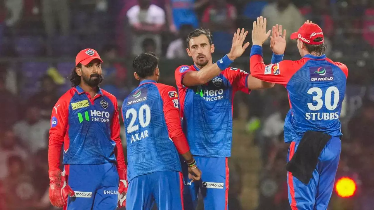 DCs Mitchell Starc with teammates