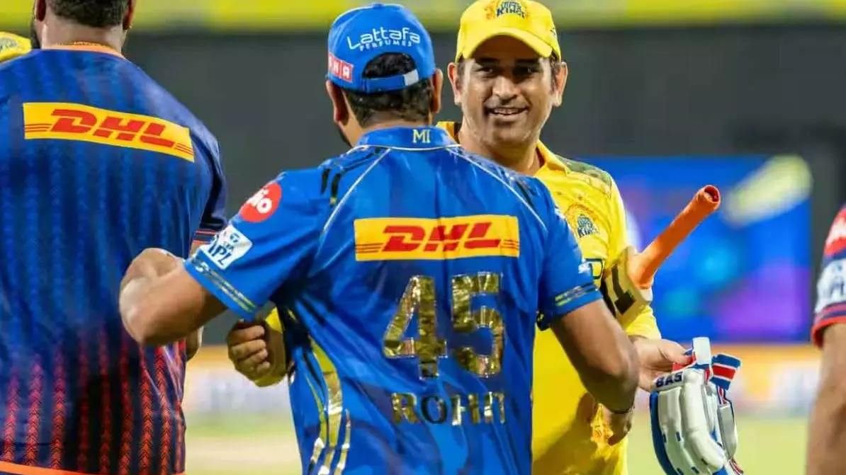 CSK captain MS Dhoni (right) with MIs Rohit Sharma