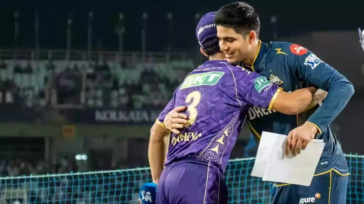 GT captain Shubman Gill (right) hugs KKR skipper Ajinkya Rahane