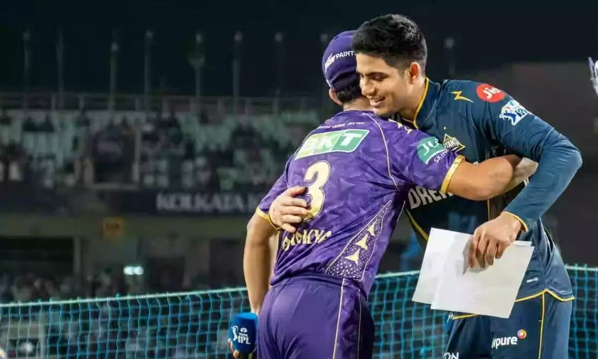 GT captain Shubman Gill (right) hugs KKR skipper Ajinkya Rahane