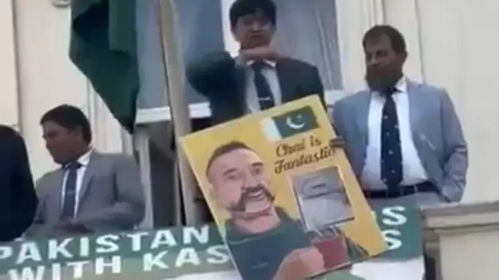 A Pakistani diplomatic official makes a throat-slit gesture A Pakistani diplomatic official makes a throat-slit gesture