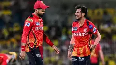 Punjab Kings (PBKS) Yuzvendra Chahal (right) celebrates with captain Shreyas Iyer