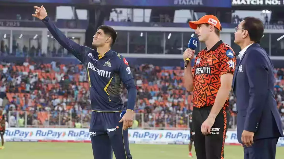 GT captain Shubman Gill (left) and SRH skipper Pat Cummins