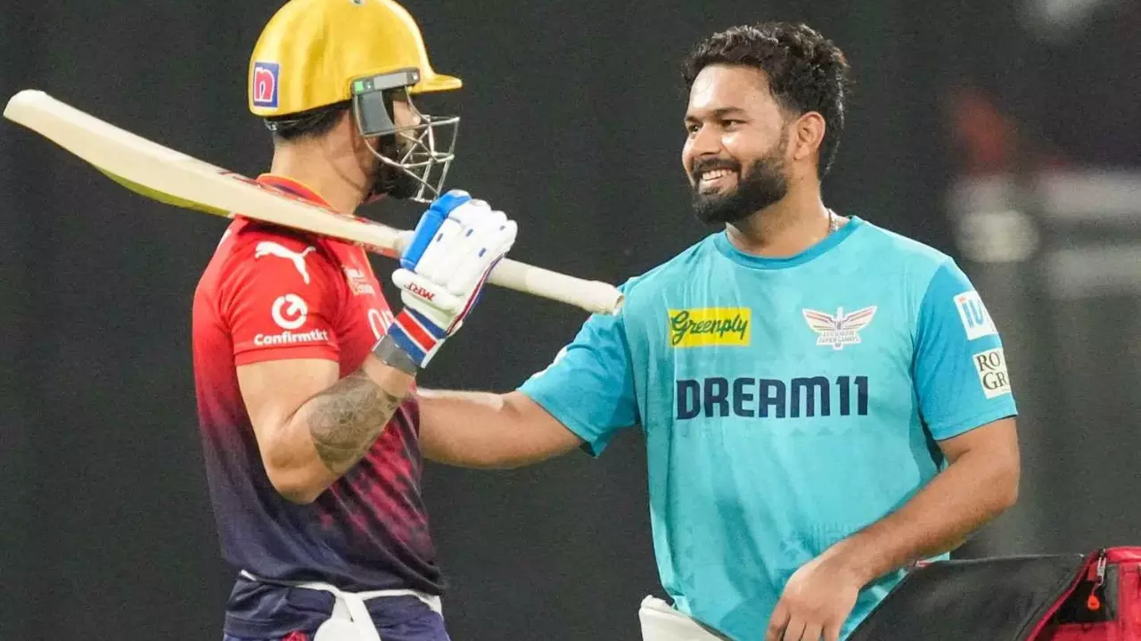 Royal Challengers Bengalurus (RCB) Virat Kohli, left, and Lucknow Super Giants (LSG) captain Rishabh Pant