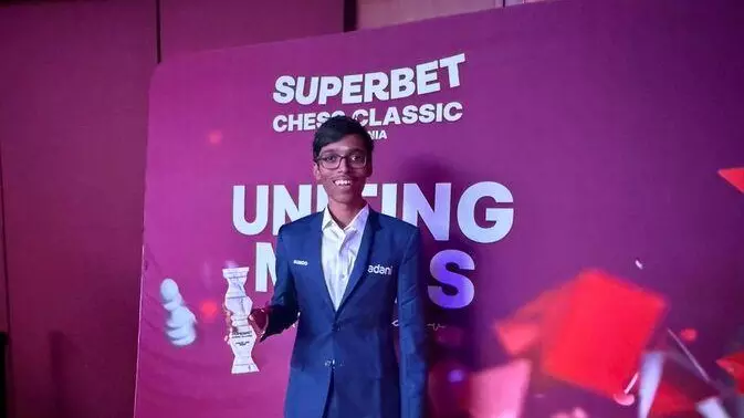 Praggnanandhaa with trophy