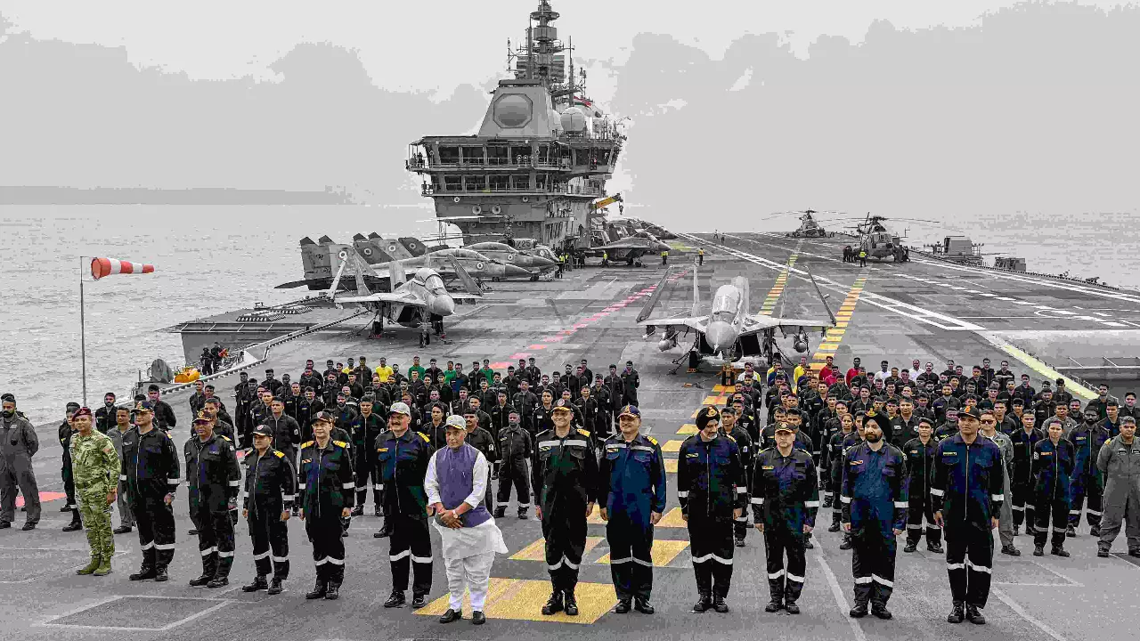 Defence Minister Rajnath Singh with Navy officers onboard INS Vikrant