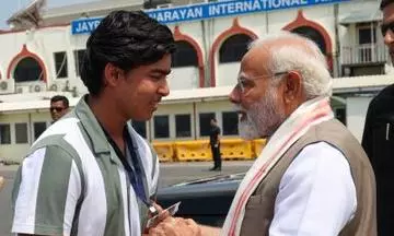 PM Modi and Vaibhav Suryavanshi speaking outside Patna airport. Photo: X/@narendramodi PM Modi and Vaibhav Suryavanshi speaking outside Patna airport. Photo: X/@narendramodi