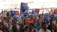 BJP supporters in Kerala with Thank You Modi placards at an event