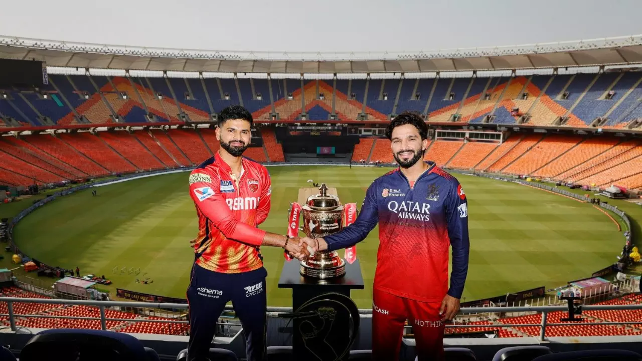 Punjab Kings (PBKS) captain Shreyas Iyer (left) and Royal Challengers Bengaluru (RCB) skipper Rajat Patidar pose with the IPL trophy