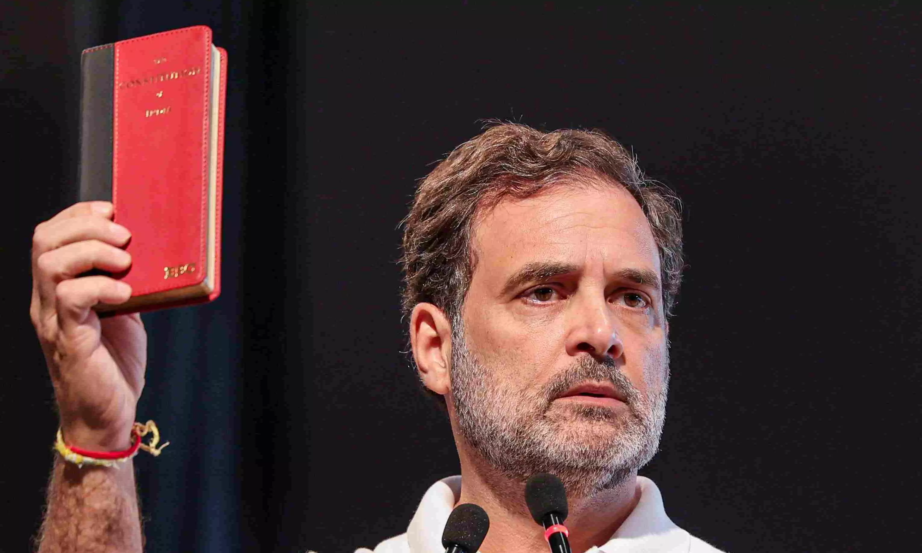 File photo of Congress MP Rahul Gandhi holding up a copy of the Indian Constitution during a public address. Photo: PTI