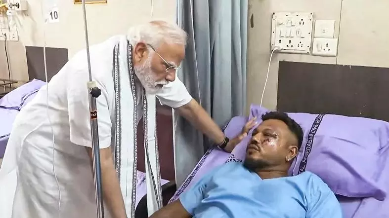 Modi with Ahmedabad crash survivor