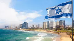 View of Tel Aviv beach in summer time with Israel Flag