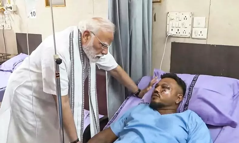 Modi with Ahmedabad crash survivor Modi with Ahmedabad crash survivor