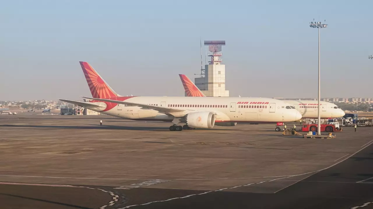 An Air India airlines plane is parked in the airport area
