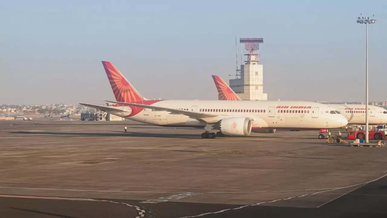 An Air India airlines plane is parked in the airport area