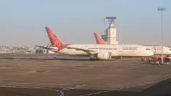 An Air India airlines plane is parked in the airport area