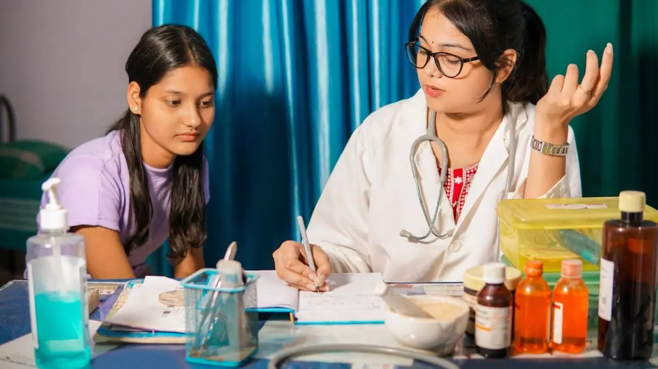 Indian female doctor writing a medical prescription on paper for medication treatment