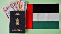 Indian Passport with UAE currency notes and Flag