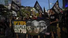People take part in a protest demanding the end of the war and immediate release of hostages held by Hamas in the Gaza Strip