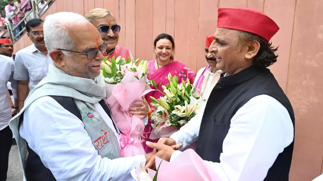 Vice-President candidate Sudershan Reddy (left) with Samajwadi Party (SP) chief Akhilesh Yadav