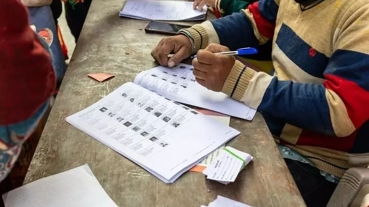 party workers at electoral booth