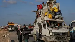 Displaced Palestinians flee northern Gaza with their belongings toward the south on Thursday, September 11, 2025, after the Israeli Army issued evacuation orders from Gaza City. (Photo: AP/PTI)