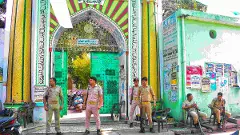 Police personnel stand guard outside a dargah in Bareilly, UP