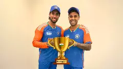Tilak Varma, Suryakumar Yadav with imaginary trophy