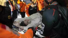 65 buried in Indonesia school building collapse; rescuers run oxygen to survivors