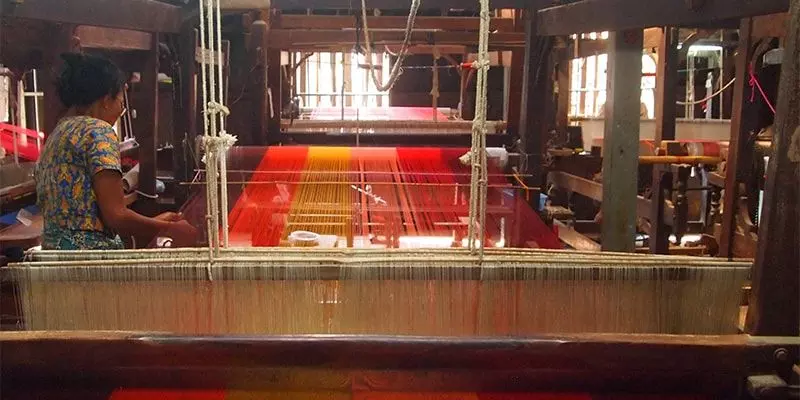 Weaving underway at a silk factory. By special arrangement