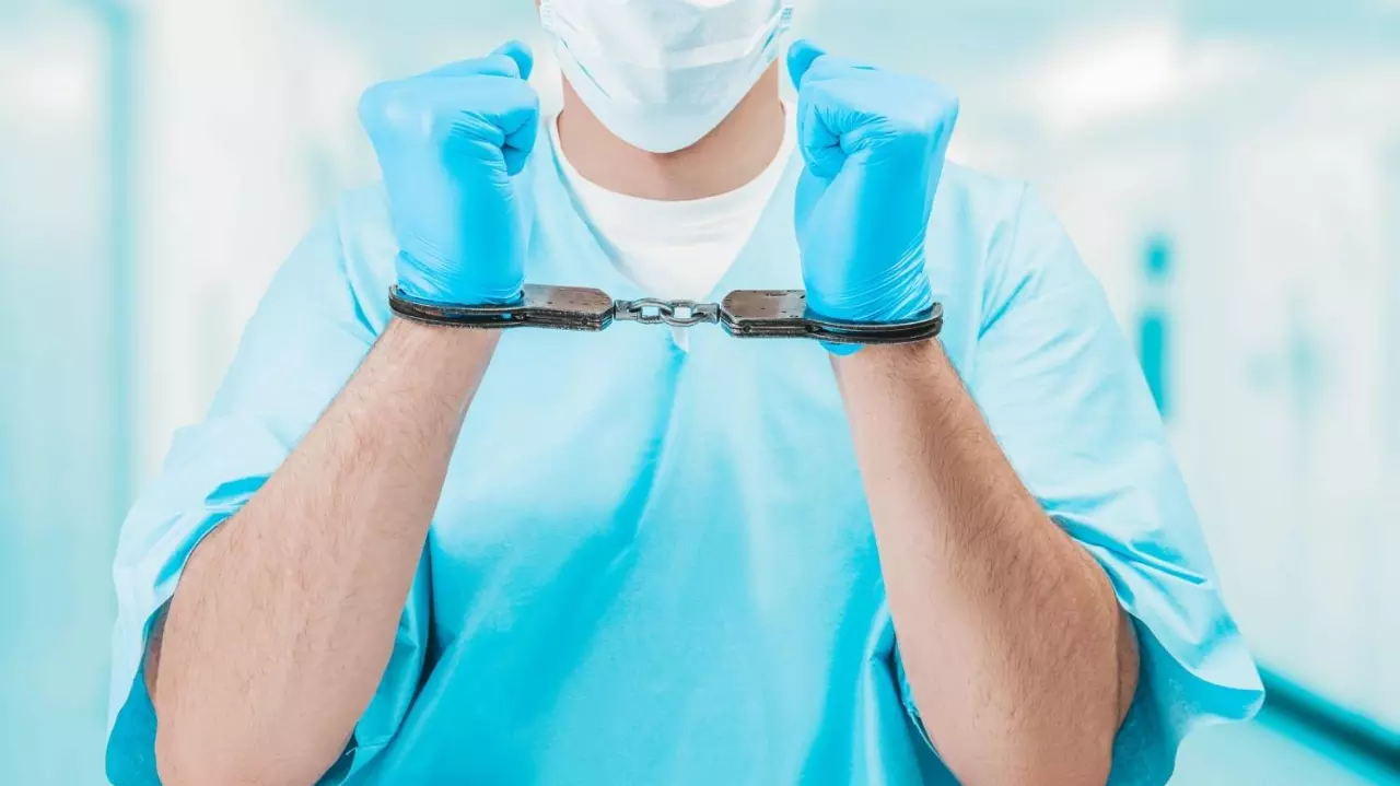 Portrait of a nurse in handcuffs