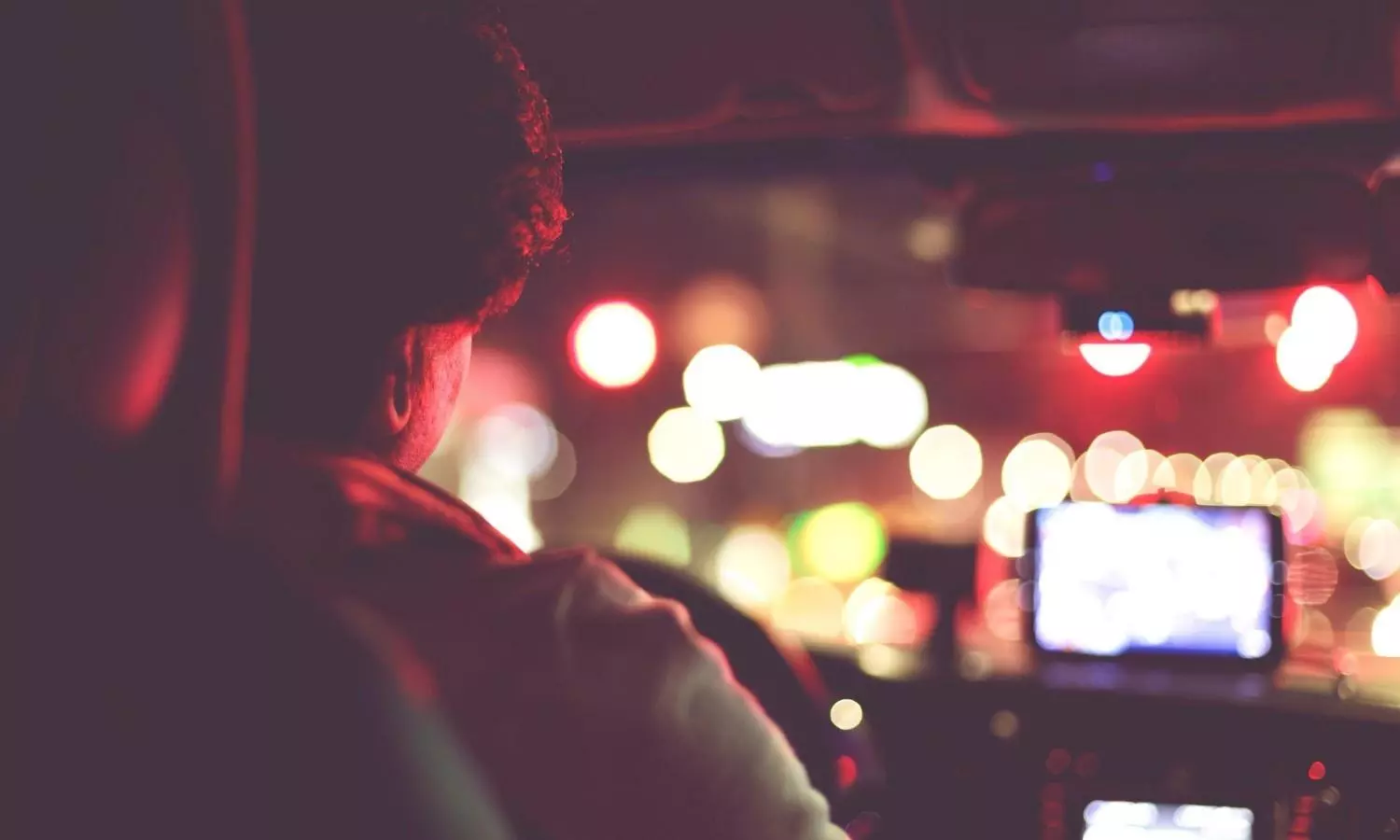 Rear View Of Man Driving Car At Night stock photo Rear View Of Man Driving Car At Night stock photo