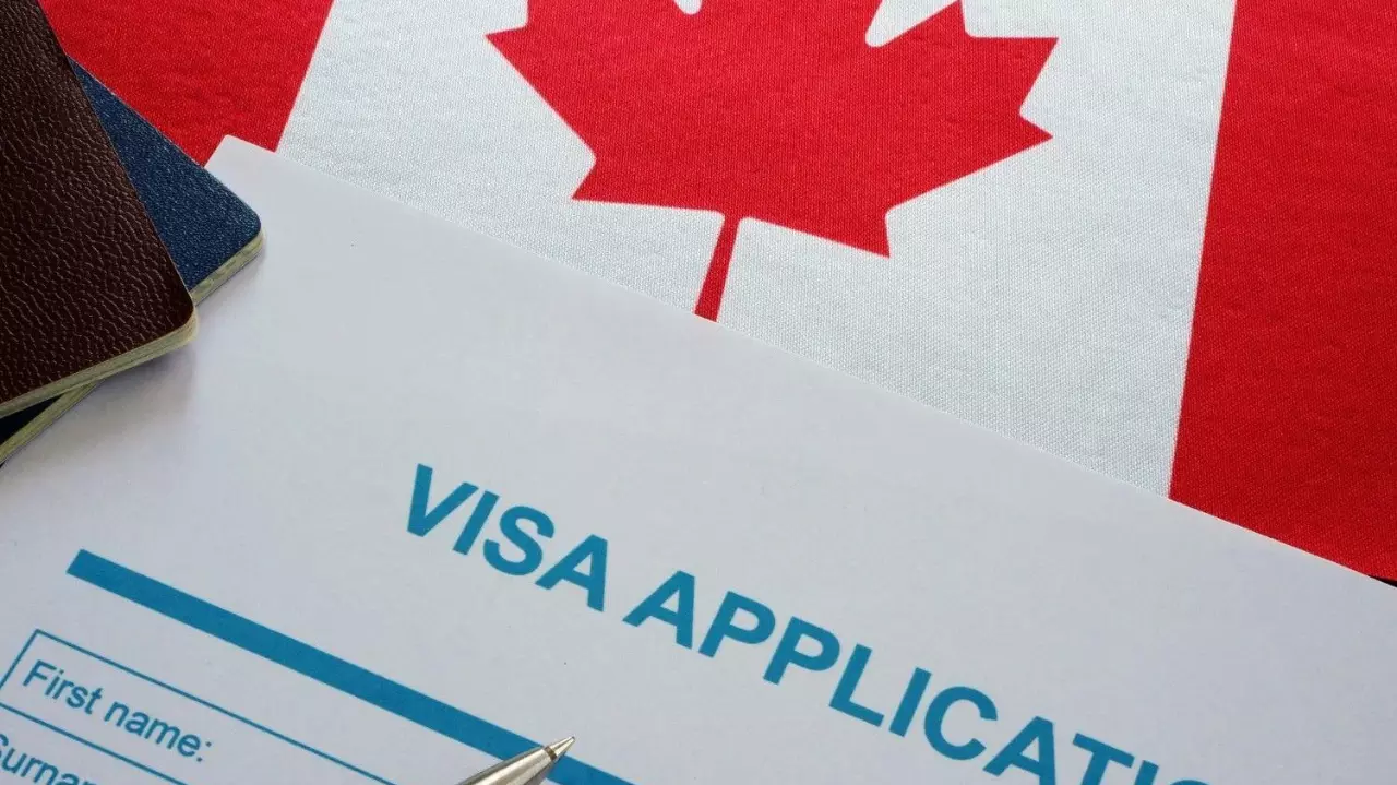 visa application form and Canada flag