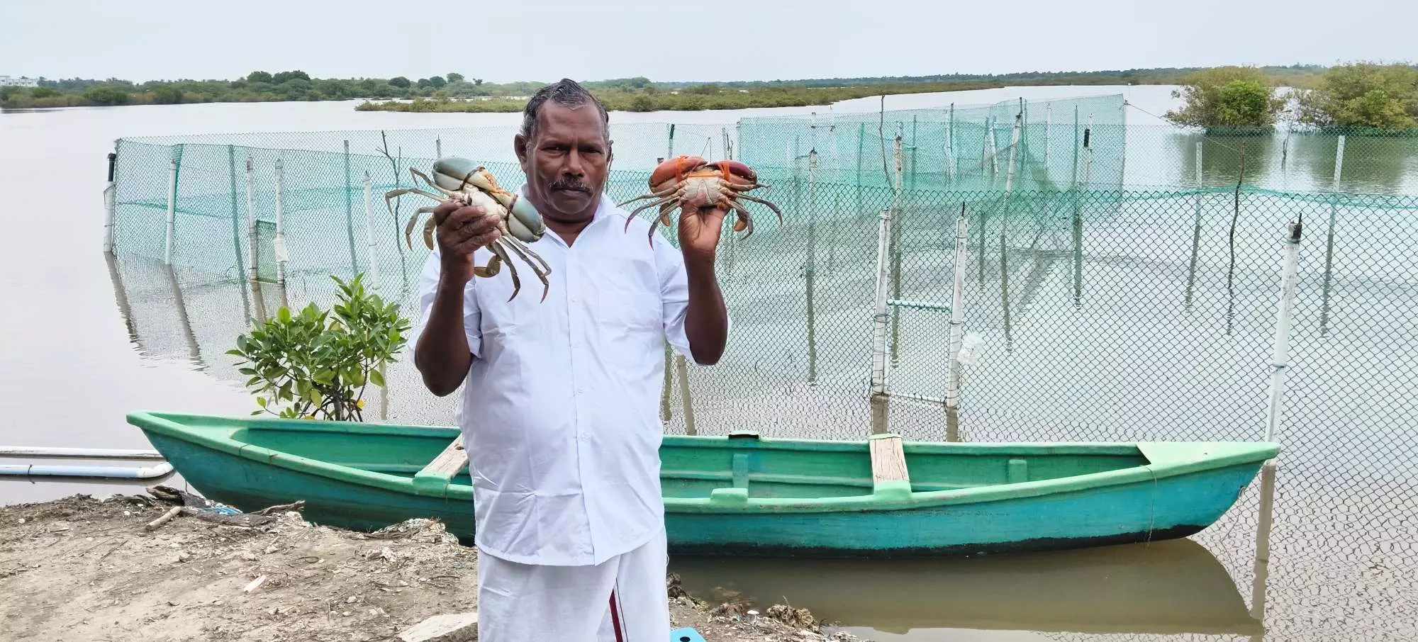 Veerappan in front of the crab-fattening unit. Photo by special arrangement