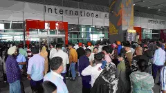 People wait outside the arrivals and exit at the Indira Gandhi International (IGI) Airport, in New Delhi People wait outside the arrivals and exit at the Indira Gandhi International (IGI) Airport, in New Delhi