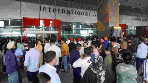 People wait outside the arrivals and exit at the Indira Gandhi International (IGI) Airport, in New Delhi People wait outside the arrivals and exit at the Indira Gandhi International (IGI) Airport, in New Delhi