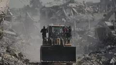 Hamas militants and Egyptian workers search for the bodies of Israeli hostages in Gaza