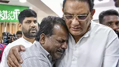 Telangana Minister Azharuddin consoling a relative of some of the victims Telangana Minister Azharuddin consoling a relative of some of the victims