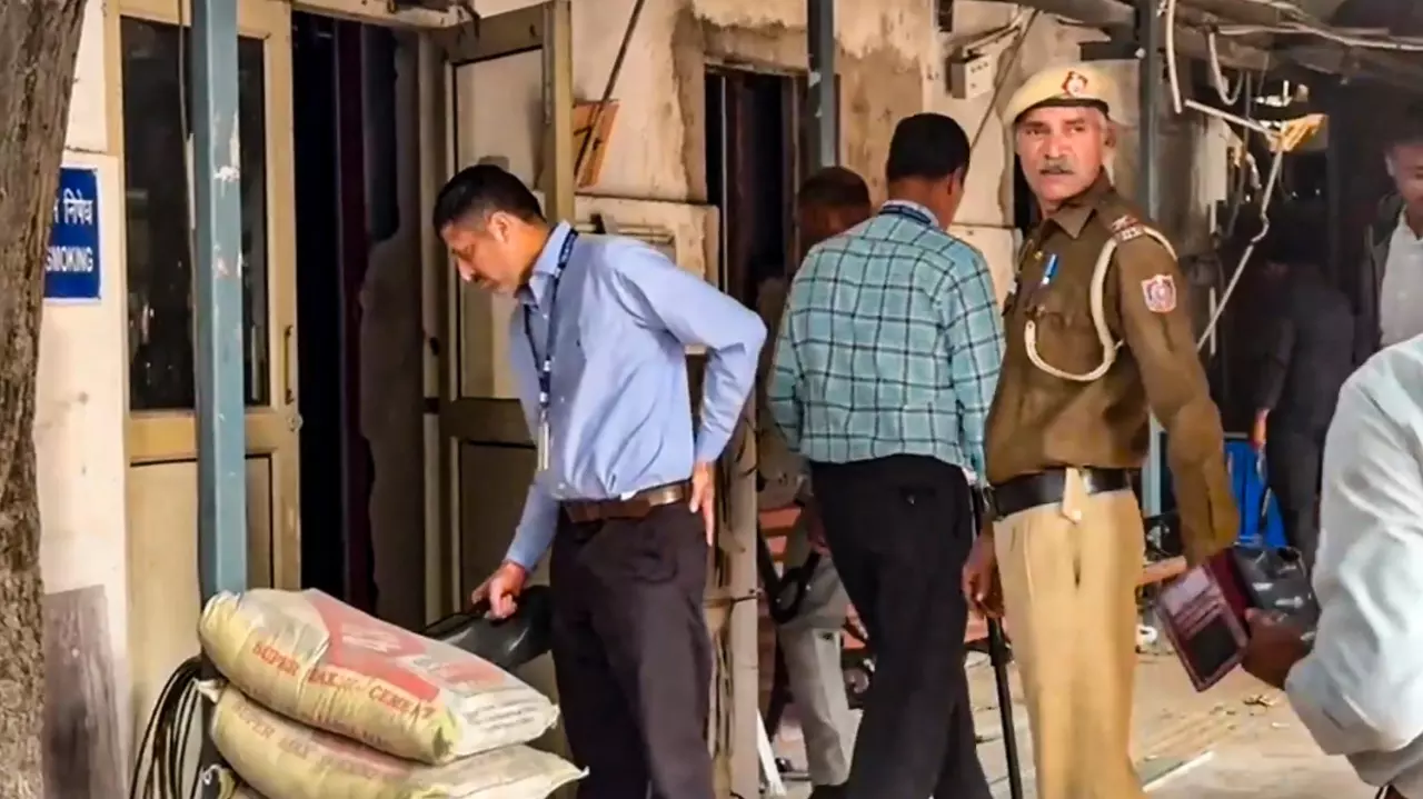 Security personnel inspect the premises of the Patiala House Court after it received a bomb threat