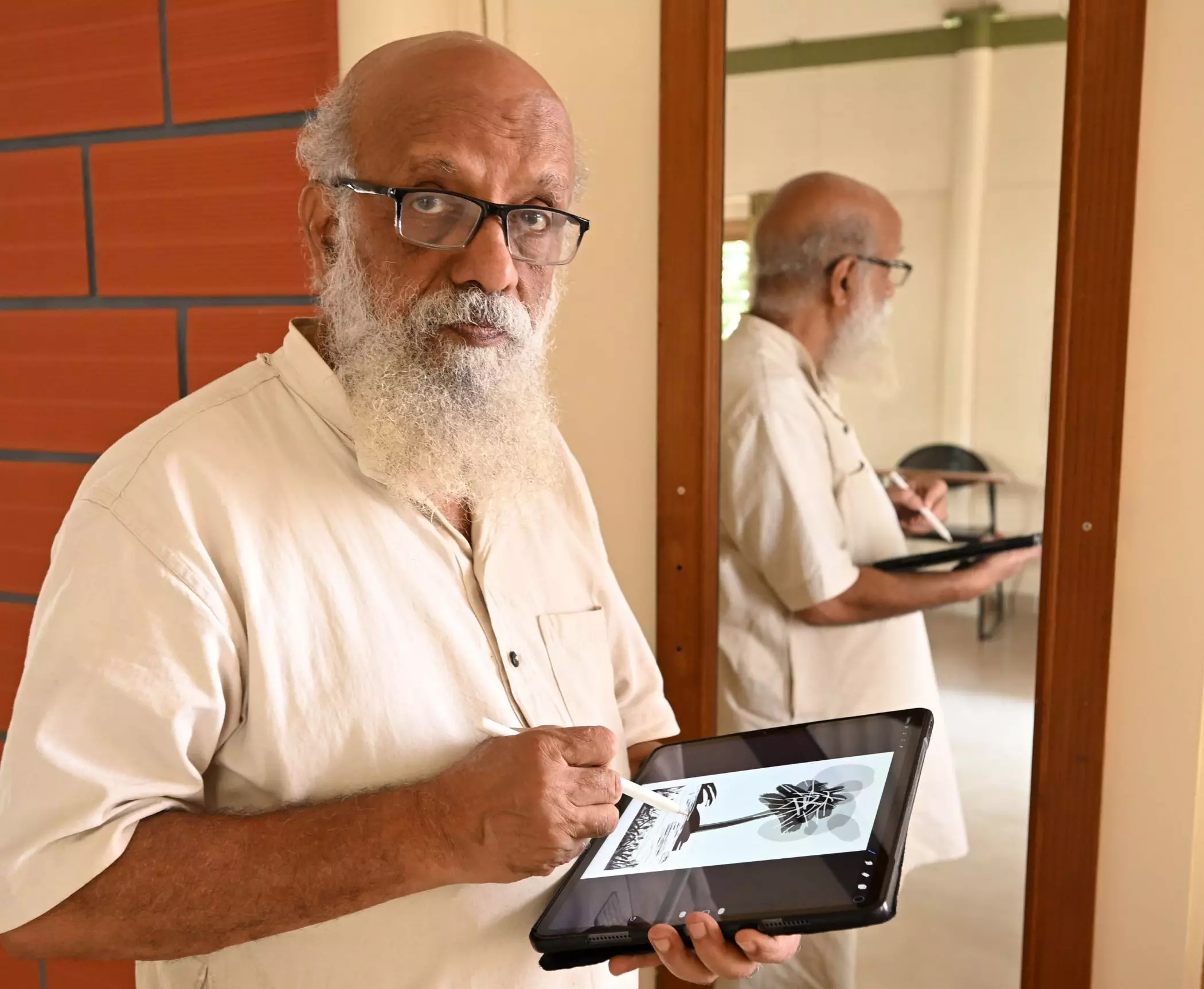 Prasanna sketches on his iPad. Photo: K Bhagya Prakash Prasanna sketches on his iPad. Photo: K Bhagya Prakash