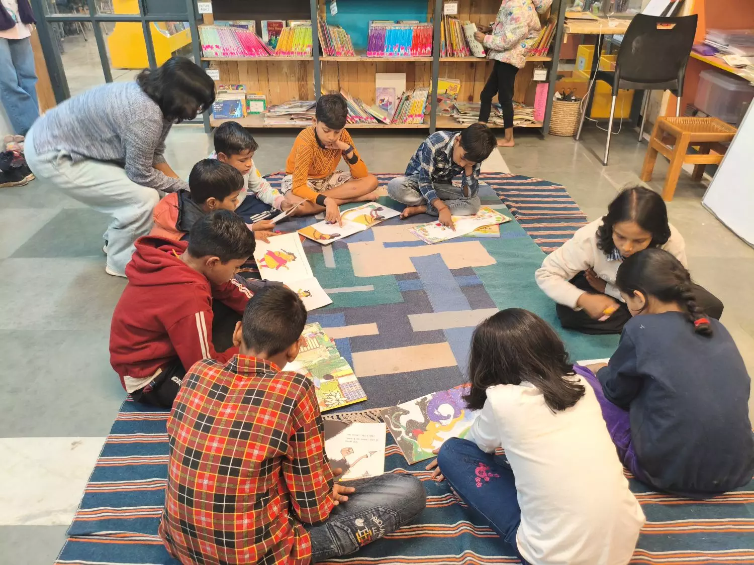 Children engaged in reading at TCLPs Kotla Mubarakpur facility. Photo: Aranya Shankar Children engaged in reading at TCLPs Kotla Mubarakpur facility. Photo: Aranya Shankar