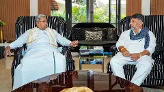 Karnataka Chief Minister Siddaramaiah interacts with Deputy CM DK Shivakumar during a breakfast meeting at his residence