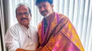 Senior leader and orator Nanjil Sampath with TVK leader Vijay