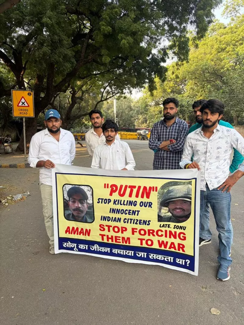 Protestors hold a banner with images of Aman and Sonu. Photo: Sat Singh