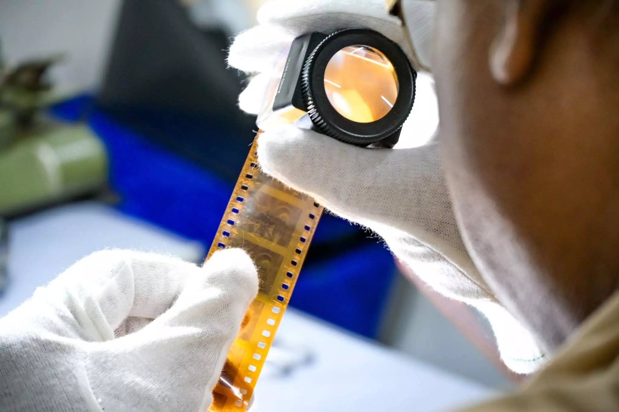 An expert works on restoring a film. Photo: By Special Arrangement An expert works on restoring a film. Photo: By Special Arrangement