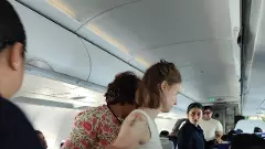 Former MLA Anjali Nimbalkar helping the sick passenger Former MLA Anjali Nimbalkar helping the sick passenger