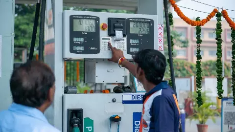Petrol Pump Staff Assisting a Visitor stock photo